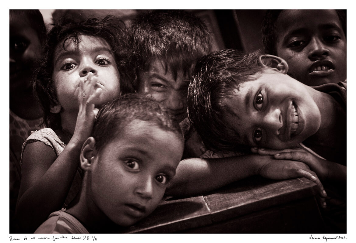 Leena captures a moment of unfiltered joy as children giggle and play in the heart of the red light district