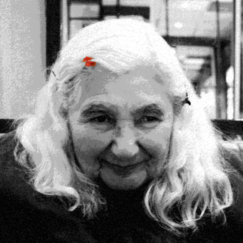 A black-and-white digitally edited portrait of an elderly woman with wavy white hair, wearing hair clips, and smiling slightly